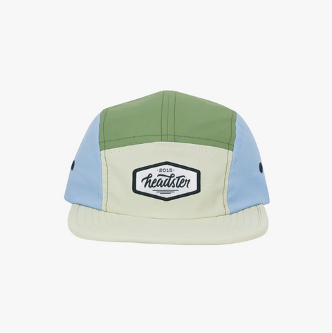 Color-blocked cap with a logo on a white background