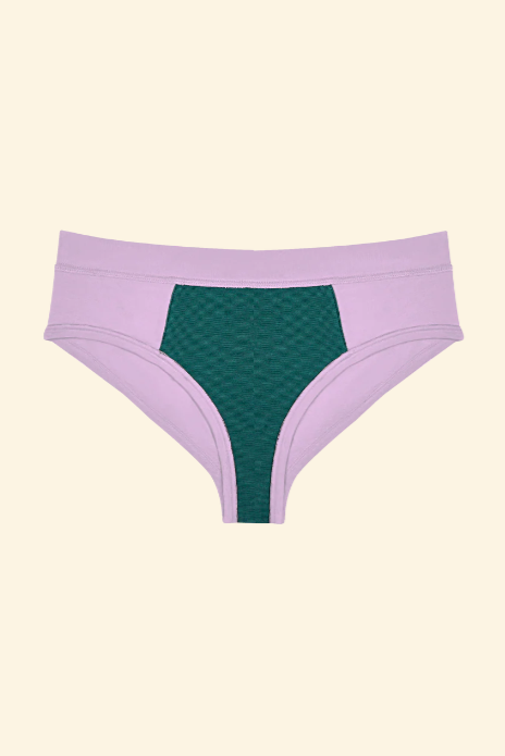 Purple and green women's underwear on a beige background