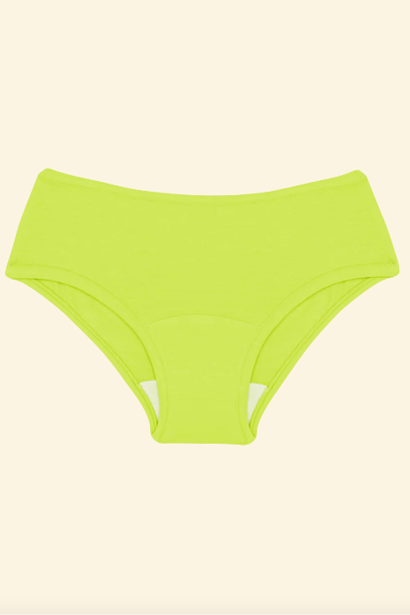 Lime green high-waisted bikini bottom on a beige background