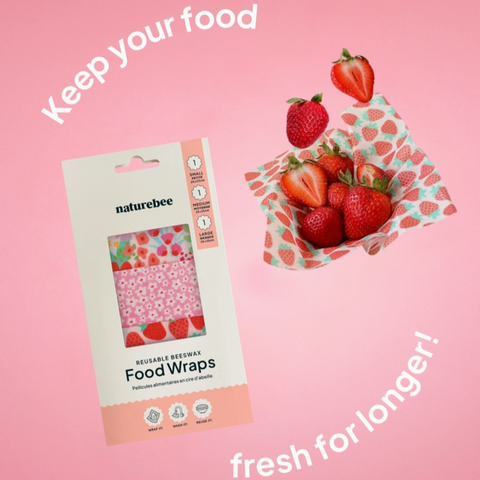 Naturebee reusable beeswax food wraps packaging with strawberries on a pink background