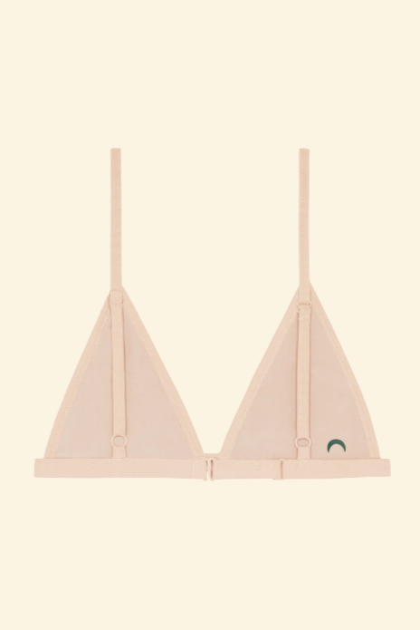 Light pink bra on a beige background