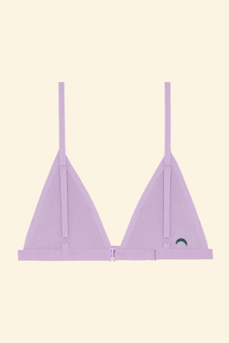 Lavender bralette with thin straps on a beige background