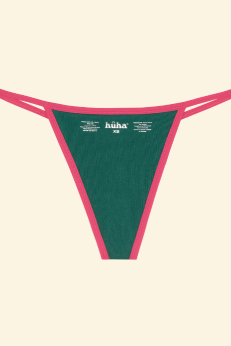 Green and pink thong with 'höha' branding on a beige background