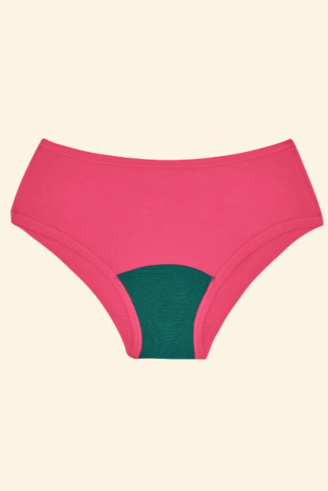 Pink high-waisted underwear with green interior on a beige background