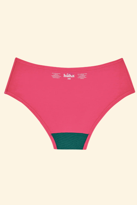 Pink women's underwear with green waistband on a beige background