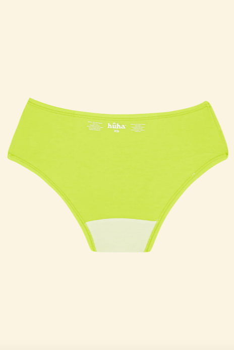 Green high-waisted bikini bottom on a beige background