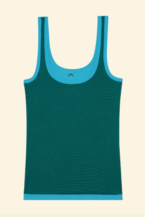 Green tank top with blue trim on a beige background