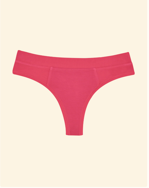 Pink thong on a beige background