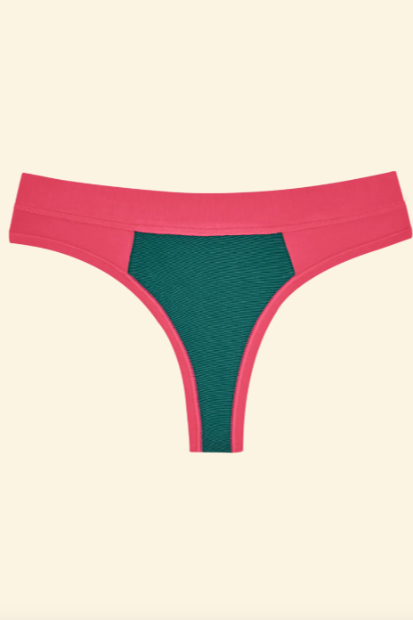 Pink and green bikini bottom on a beige background