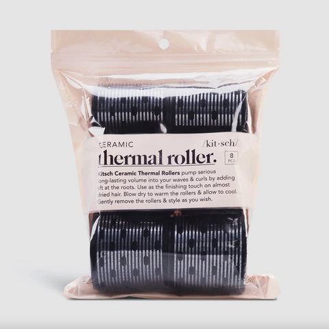 Packaged ceramic thermal rollers with clear plastic cover on a light gray background
