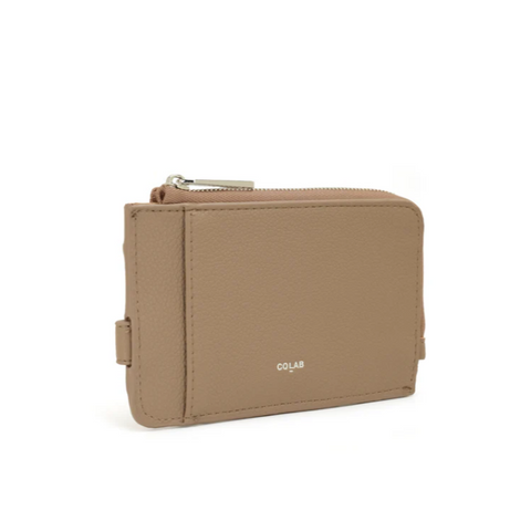 Beige wallet with visible brand name on a white background
