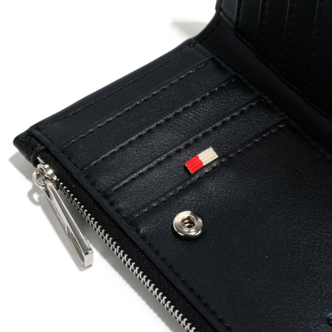 Close-up of a black wallet with a zipper and visible brand logo on a white background.