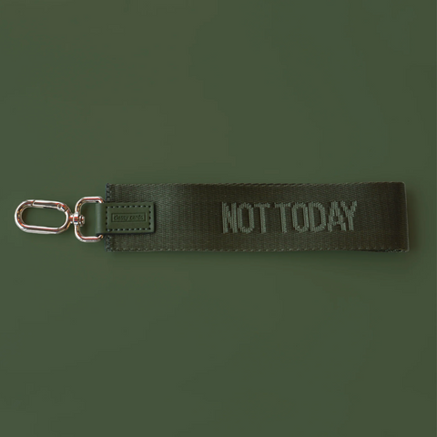 Black keychain with 'NOT TODAY' text on a dark green background