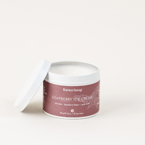 A container of Ravensong Soapberry Ice Cream candle with the lid off, on a white background.