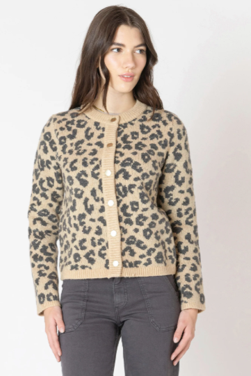 Woman wearing a leopard print cardigan on a white background