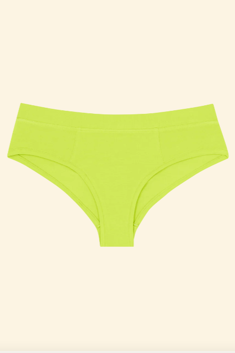Green underwear on a beige background