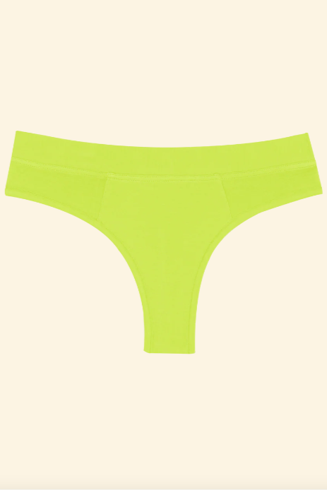 Lime green thong on a beige background