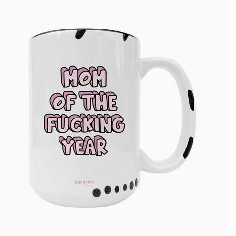 White mug with pink text 'Mom of the Fucking Year' on a white background