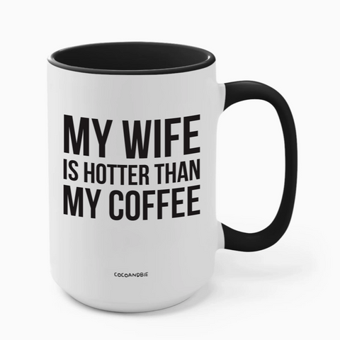White mug with black interior and handle, featuring text 'My wife is hotter than my coffee' on a white background.