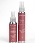 Two bottles of Raven Song Coastal Uplift room and linen mist on a white background