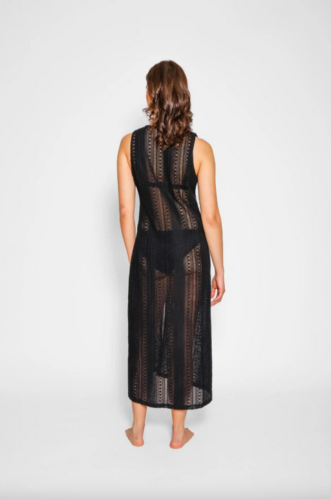 Woman wearing a black lace dress on a white background