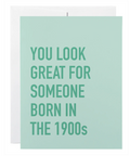 Card with text 'You look great for someone born in the 1900s' on a light green background