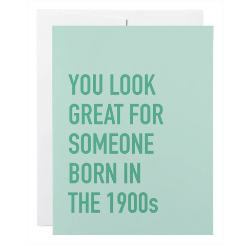 Card with text 'You look great for someone born in the 1900s' on a light green background