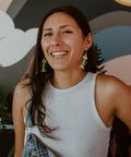 Model wears neon pear small salmon ghost earrings