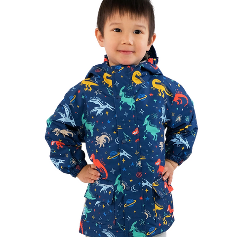 Child wearing a colorful jacket with space-themed designs on a white background