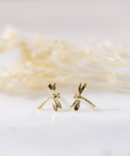 Gold earrings on a white background