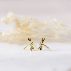 Gold earrings on a white background