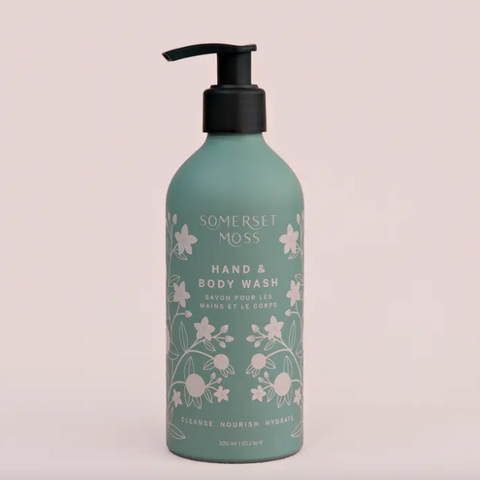 Somerset Moss hand and body wash bottle on a light pink background