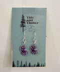 Pair of earrings on a 'Tide and Timber' branded card with a nature-themed design.
