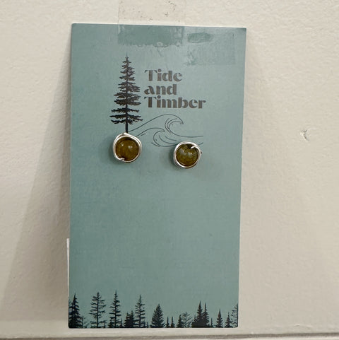 Pair of earrings on a 'Tide and Timber' branded card with a tree design.