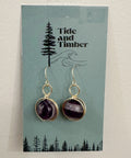 Amethyst earrings on a Tide and Timber branded card with a forest design.
