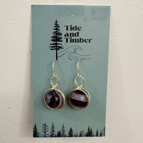 Amethyst earrings on a Tide and Timber branded card with a forest design.