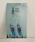 Earrings on a 'Tide and Timber' branded card with a nature-themed design.