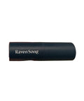 Hand holding a cylindrical product labeled 'Raven Song' against a neutral background