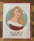 Card with illustration of a woman and text on a wooden surface