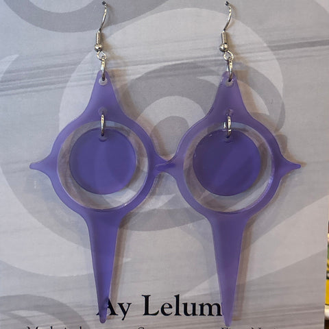 Packaged Coast Salish Art Earrings with a purple design on a wooden surface.