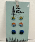 Set of earrings on a 'Tide and Timber' branded card against a light background