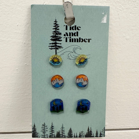 Set of earrings on a 'Tide and Timber' branded card against a light background