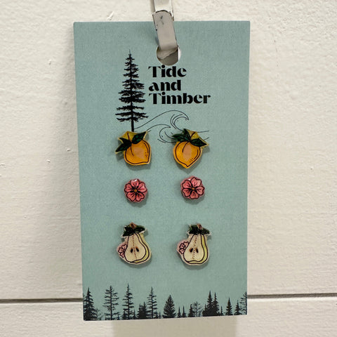 Set of earrings on a Tide and Timber branded card with a white background