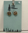 Pair of earrings on a 'Tide and Timber' branded card against a light background