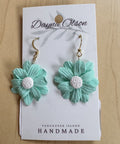 Pair of turquoise flower earrings on a 'Dayna Olson' card with 'Vancouver Island Handmade' text.