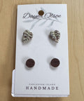 Set of earrings on a 'Dayna Olson' card with 'Vancouver Island Handmade' text on a wooden surface.