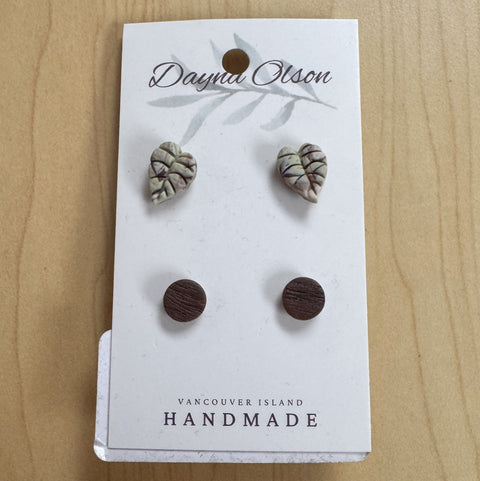 Set of earrings on a 'Dayna Olson' card with 'Vancouver Island Handmade' text on a wooden surface.