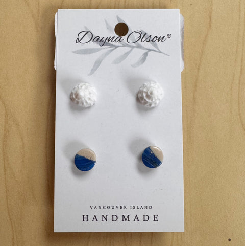 Set of earrings on a 'Dayna Olson' card with 'Vancouver Island Handmade' text on a wooden surface.