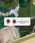 Product with 'Cumberland' branding on a reflective surface