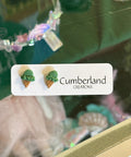 Product with 'Cumberland Editions' label on a blurred background